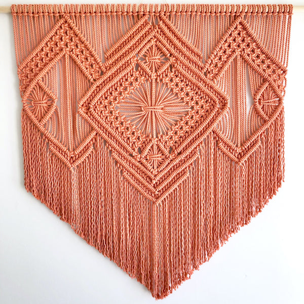 A blood orange tapestry with diamond patterns